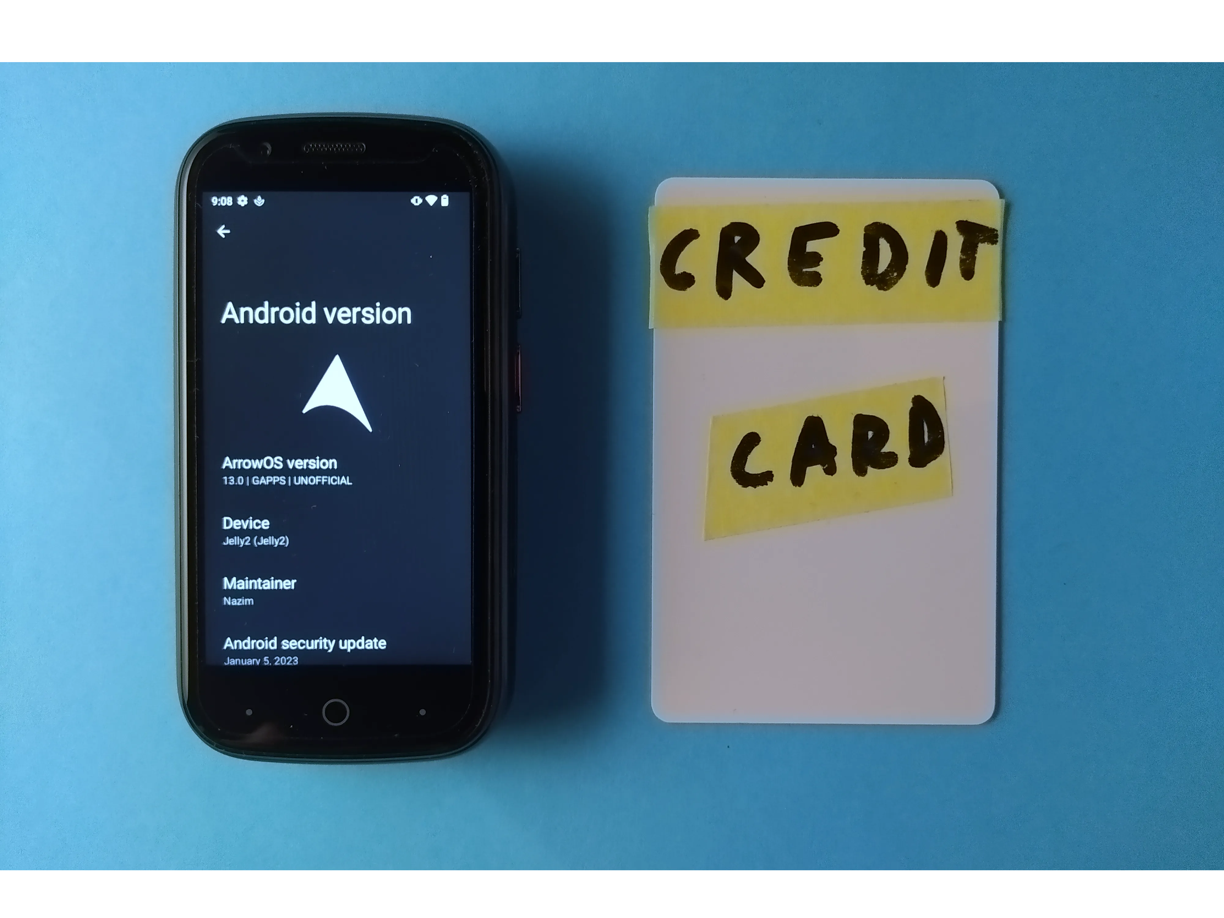 Unihertz Jelly 2 alongside a white plastic credit-card-sized card